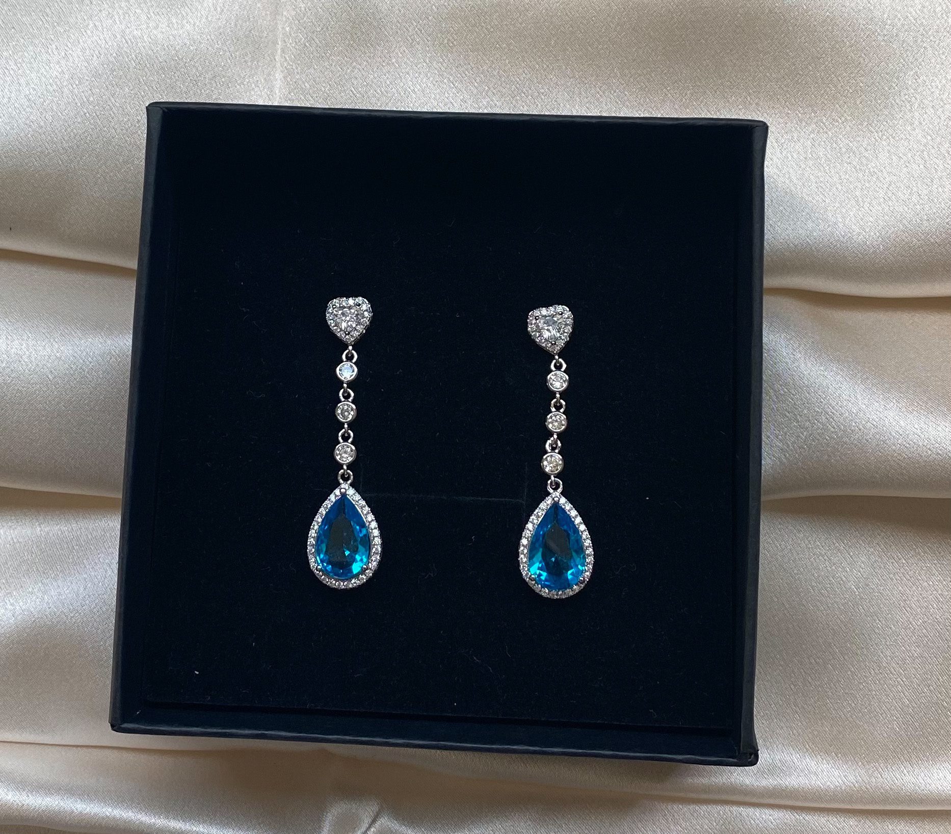 Vandana B- Teardrop Crystal Earrings with Blue Stone